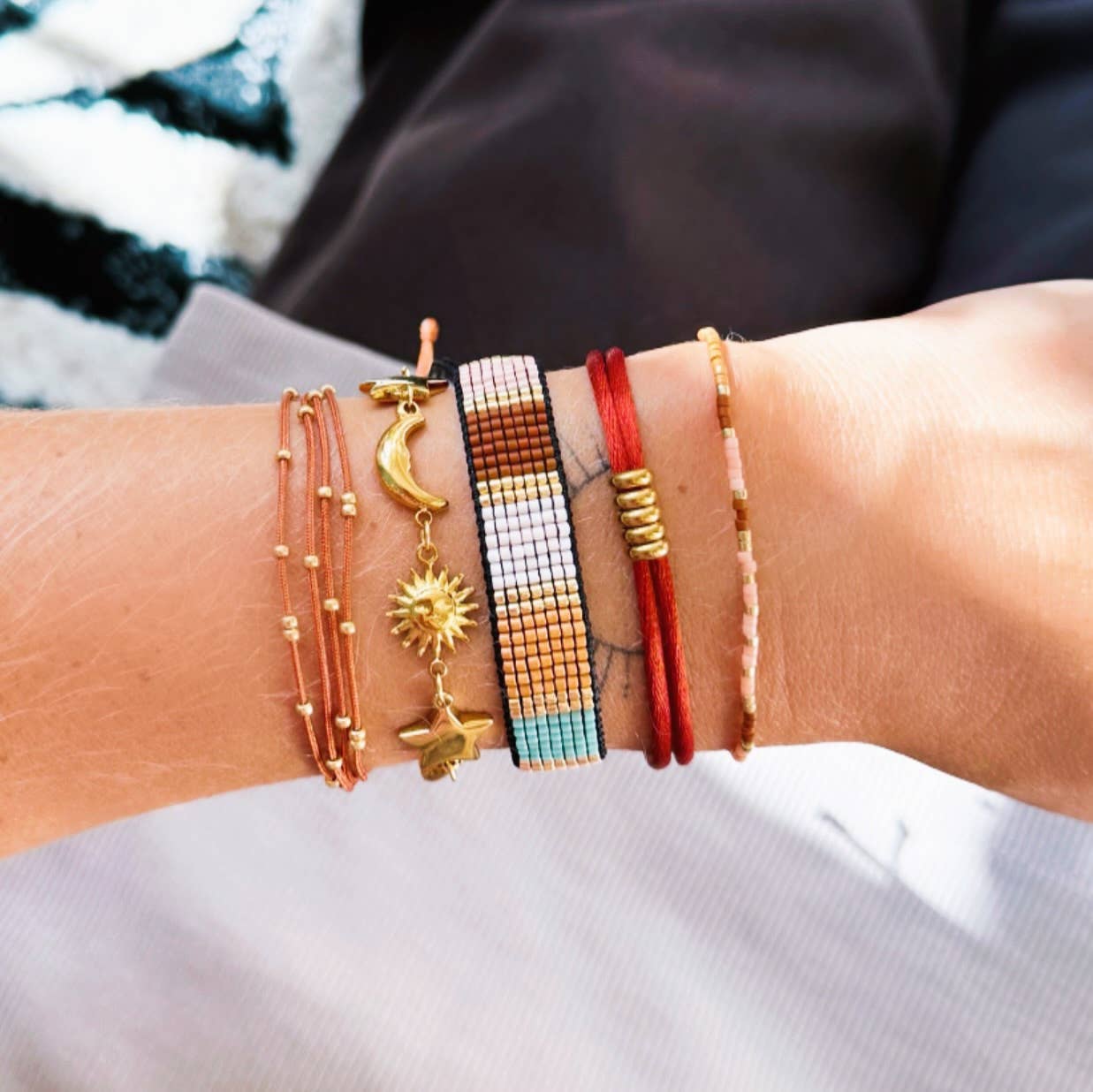 Schakelarmband met zon, maan en ster